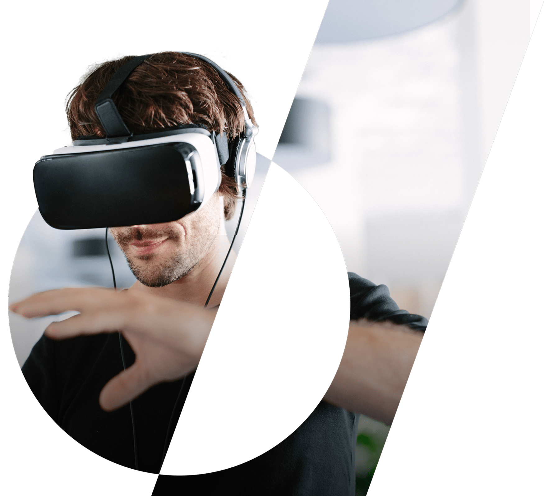 A man puts a hand out whilst wearing a VR headset